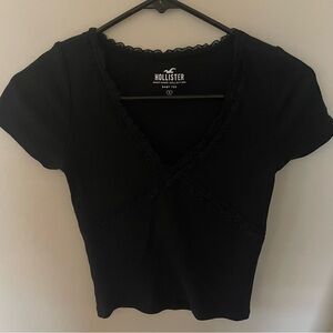 Size small, black Hollister baby tee.